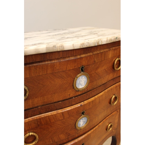 590 - A Louis XV style kingwood marble top washstand, late 19th century, the three drawers applied with ja... 