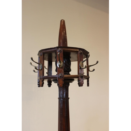 592 - A 19th century mahogany hat stand, the leaf carved and reeded column raised upon a square stepped pl... 