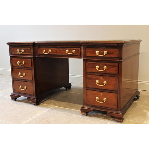 594 - A 19th century mahogany inverted break-front pedestal desk, inset with a leather skiver above a cent... 