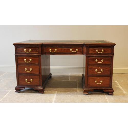 594 - A 19th century mahogany inverted break-front pedestal desk, inset with a leather skiver above a cent... 