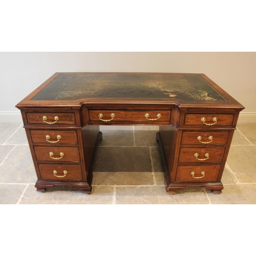 594 - A 19th century mahogany inverted break-front pedestal desk, inset with a leather skiver above a cent... 