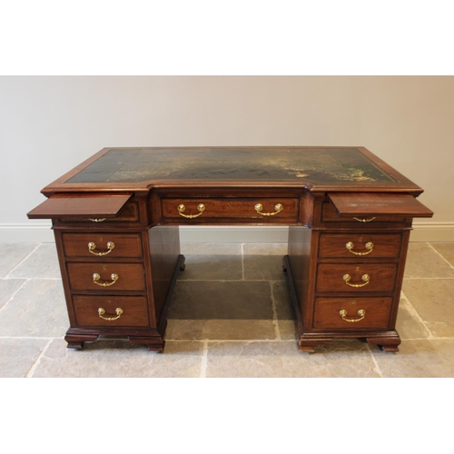 594 - A 19th century mahogany inverted break-front pedestal desk, inset with a leather skiver above a cent... 