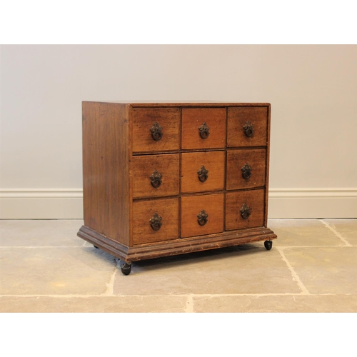 601 - A 19th century and later mahogany specimen chest, with an arrangement of nine drawers, applied with ... 