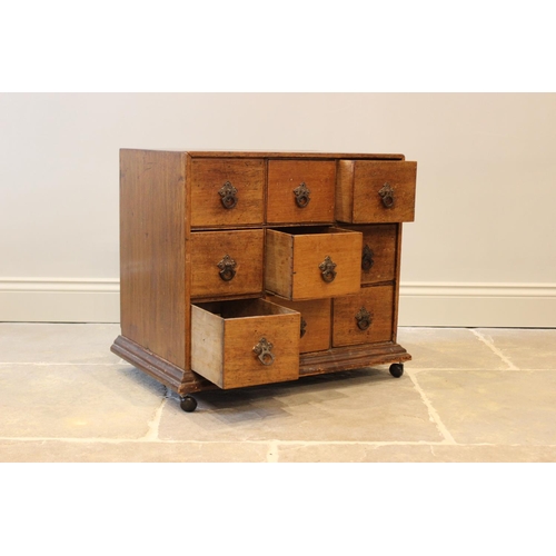 601 - A 19th century and later mahogany specimen chest, with an arrangement of nine drawers, applied with ... 