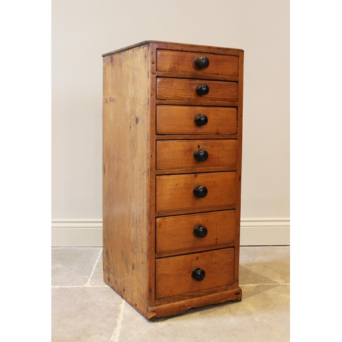 603 - A Victorian pine pedestal chest, with seven graduated drawers applied with ebonised knob handles, ra... 