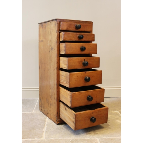 603 - A Victorian pine pedestal chest, with seven graduated drawers applied with ebonised knob handles, ra... 