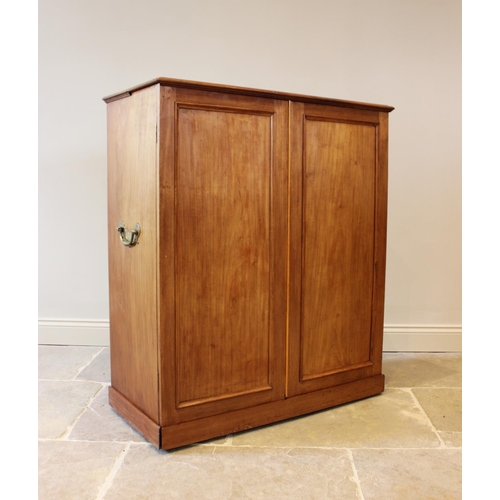 608 - A 19th century and later mahogany campaign style press cupboard, the pair of panelled doors enclosin... 