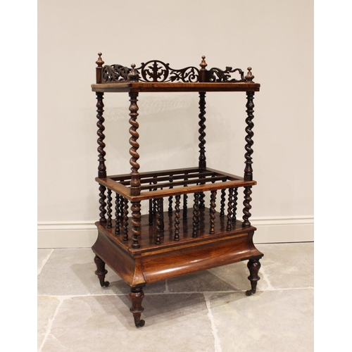 613 - An early Victorian rosewood etagere Canterbury, the four turned finials above a fretwork three quart... 