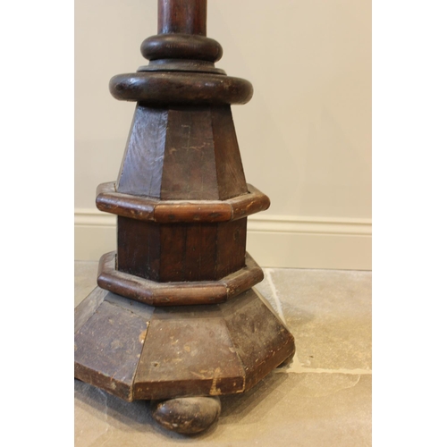 617 - A Victorian pitch pine double sided lectern, of architectural sloping form, raised upon a ring turne... 