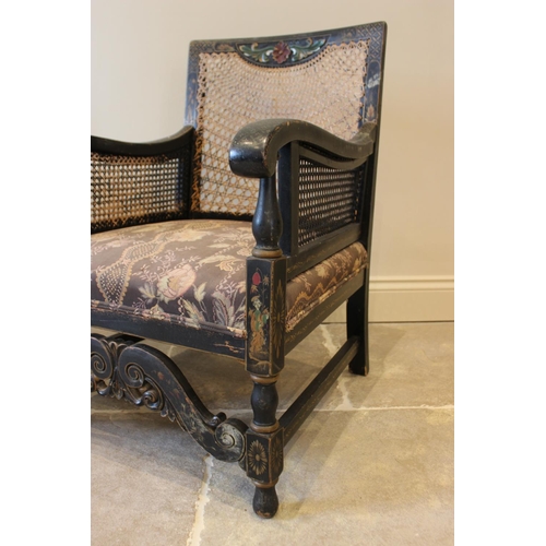 621 - A pair of early 20th century chinoiserie bergere armchairs, the rattan back above a sprung seat encl... 