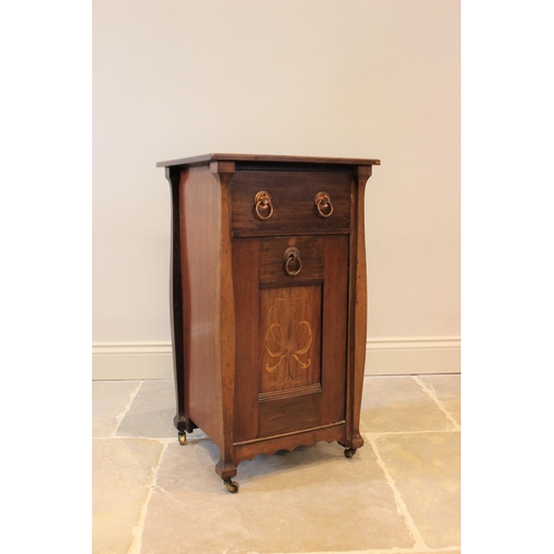 624 - An early 20th century Art Nouveau mahogany coal purdonium, the rectangular top above a single drawer... 