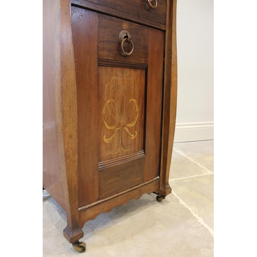 624 - An early 20th century Art Nouveau mahogany coal purdonium, the rectangular top above a single drawer... 