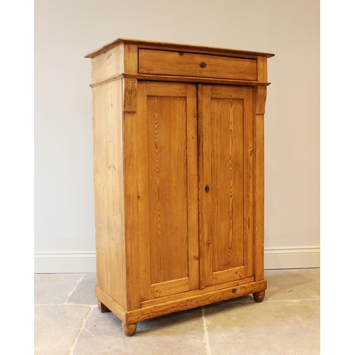 628 - An early 20th century pine hall cupboard, the single frieze drawer above a pair of cupboard doors, f... 