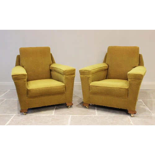 631 - A pair of Art Deco yellow upholstered armchairs, each with an angular padded back above a deep set s... 