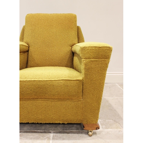 631 - A pair of Art Deco yellow upholstered armchairs, each with an angular padded back above a deep set s... 