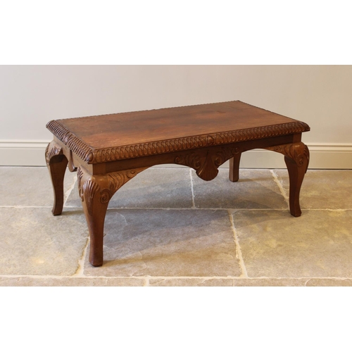 642 - A 20th century teak Queen Anne style rectangular coffee table, with shell and foliate carved detail,... 