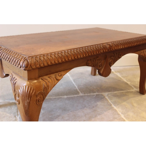 642 - A 20th century teak Queen Anne style rectangular coffee table, with shell and foliate carved detail,... 