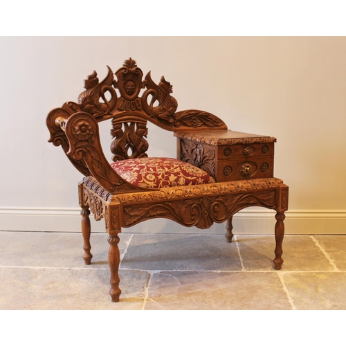 645 - A carved oak telephone table, 20th century, the carved back with mythological creatures, the upholst... 