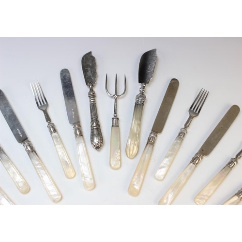 65 - A set of twelve silver and mother of pearl handled fruit knives and forks, John Gammage, Birmingham ... 