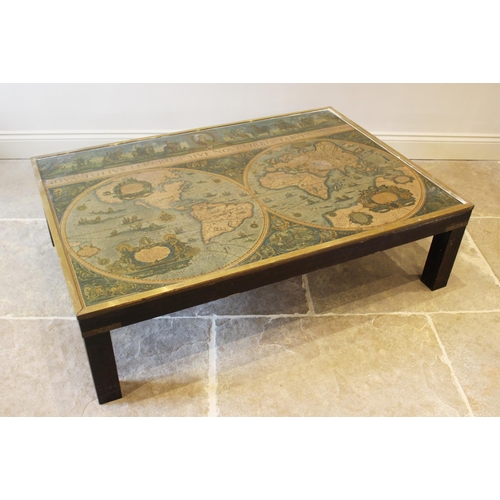 650 - A campaign style rectangular coffee table, with glazed top inset with a map and raised on four stile... 