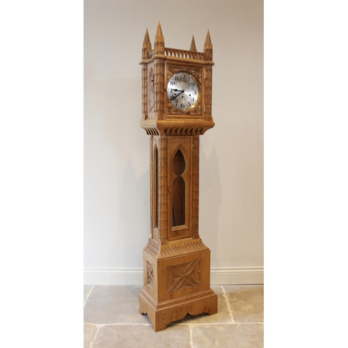 651 - An ecclesiastical carved oak grandmother clock, 20th century, the hood inspired by Lichfield Cathedr... 