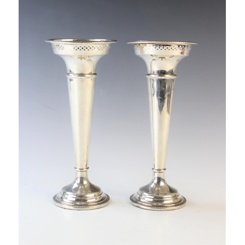 68 - A pair of George V silver trumpet vases by Walker & Hall, Sheffield 1920, of typical form with pierc... 