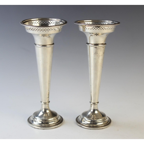 68 - A pair of George V silver trumpet vases by Walker & Hall, Sheffield 1920, of typical form with pierc... 