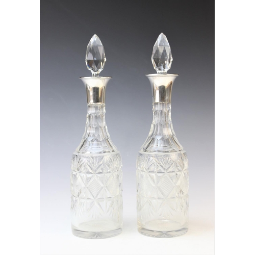 70 - A pair of George V cut glass silver mounted decanters by Henry Clifford Davis, 1927 Birmingham, each... 