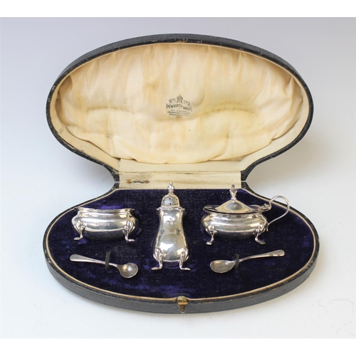 76 - A cased George V three-piece silver cruet set by Adie Brothers, Birmingham 1921, comprising pepperet... 