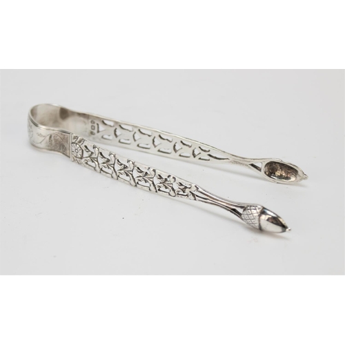 27 - A pair of George III silver sugar tongs by George Burrows, London 1793, with pierced foliate decorat... 