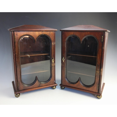 625 - A pair of 19th century and later mahogany freestanding desk top display cabinets, of architectural f... 