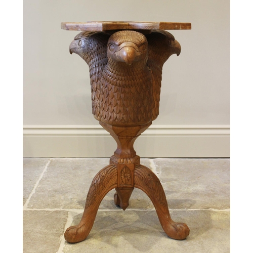 643 - A carved oak occasional table, 20th century, designed as three eagle’s masks, above a trefoil top, 6... 