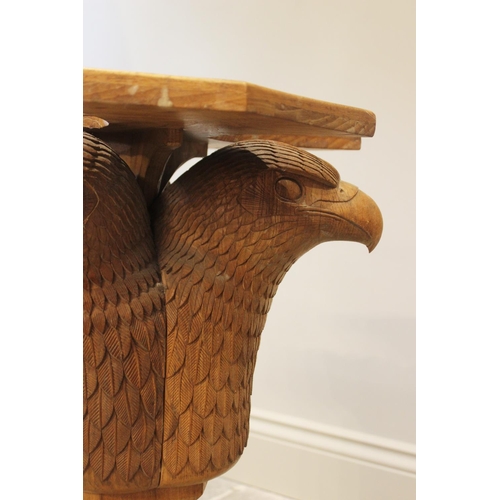 643 - A carved oak occasional table, 20th century, designed as three eagle’s masks, above a trefoil top, 6... 