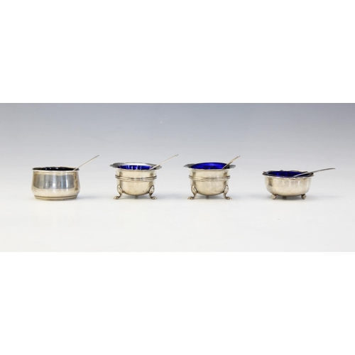 16 - A selection of silver mustard pots and salts to include; a pair of open salts by James Swann, Birmin... 