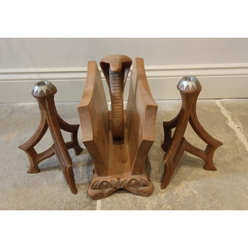 641 - A pair of carved oak Gothic revival candlesticks, 28cm high, and a carved oak canterbury with centra... 