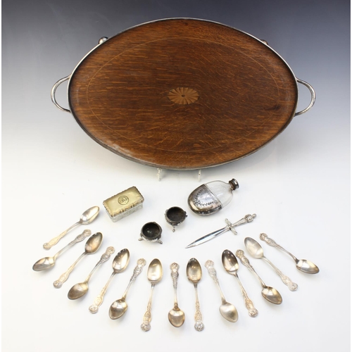 88 - An oak inlaid white metal mounted twin-handled gallery tray, of oval form on four compressed ball fe... 