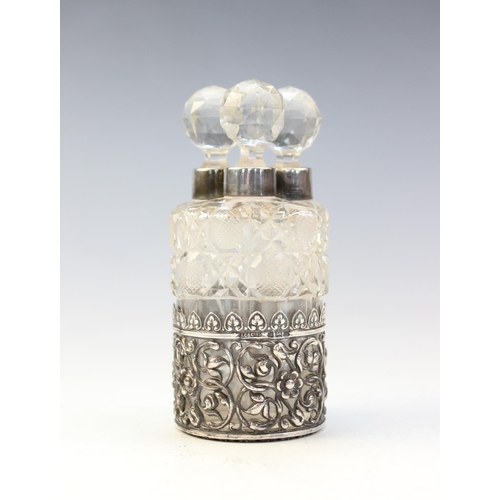 97 - An Edwardian silver mounted set of three cut glass scent bottles and stoppers by Collyer & Co, Birmi... 