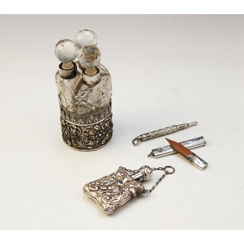 97 - An Edwardian silver mounted set of three cut glass scent bottles and stoppers by Collyer & Co, Birmi... 