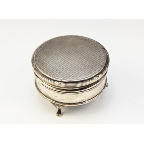 98 - A George V silver jewellery box by Walker & Hall, Sheffield 1926, of circular form on three raised f... 