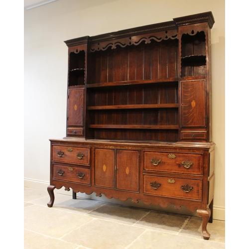 583 - A 19th century and later oak dresser, the base designed with a central cupboard section flanked by t... 