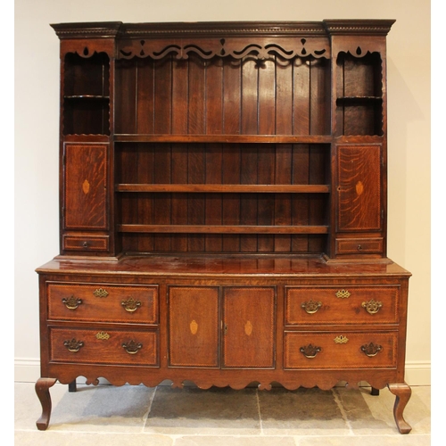 583 - A 19th century and later oak dresser, the base designed with a central cupboard section flanked by t... 