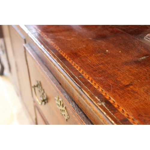 583 - A 19th century and later oak dresser, the base designed with a central cupboard section flanked by t... 