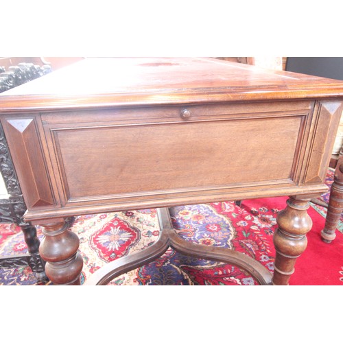 567 - A Louis XV style walnut desk, late 19th century, the rectangular moulded top inset with a leather sk... 