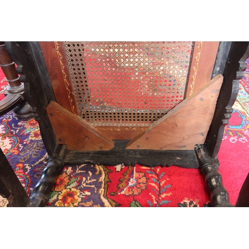 580 - A Dutch colonial Ceylonese ebony armchair, Coromandel coast, 18th/19th century, with carved lotus ba... 