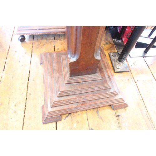 592 - A 19th century mahogany hat stand, the leaf carved and reeded column raised upon a square stepped pl... 