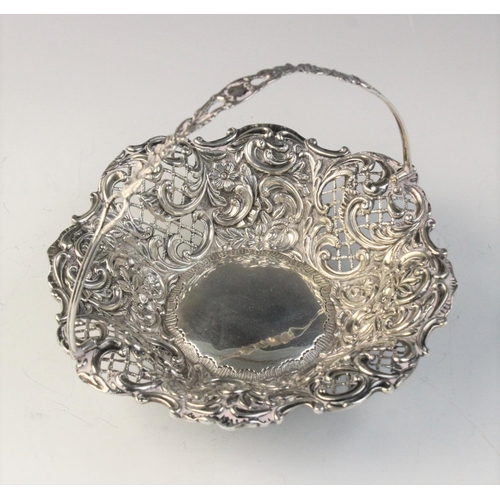 10 - An Edwardian silver swing handled basket by Henry Matthews, Birmingham (date letter worn), of shaped... 