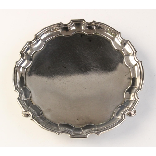 100 - A George III silver salver, London 1776 (maker’s marks indistinct), of circular form with pie crust ... 