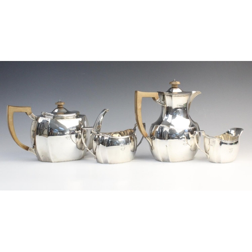 101 - A George V four-piece silver tea service by Thomas Bradbury & Sons, Sheffield 1928, comprising teapo... 