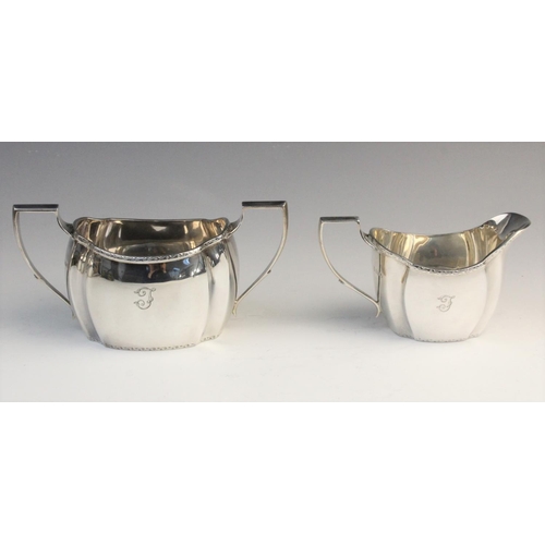 101 - A George V four-piece silver tea service by Thomas Bradbury & Sons, Sheffield 1928, comprising teapo... 