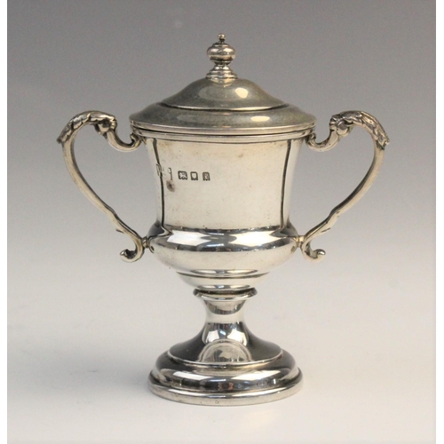 103 - A George V twin-handled silver trophy cup by F C Richards, Birmingham 1940, of typical form with kno... 